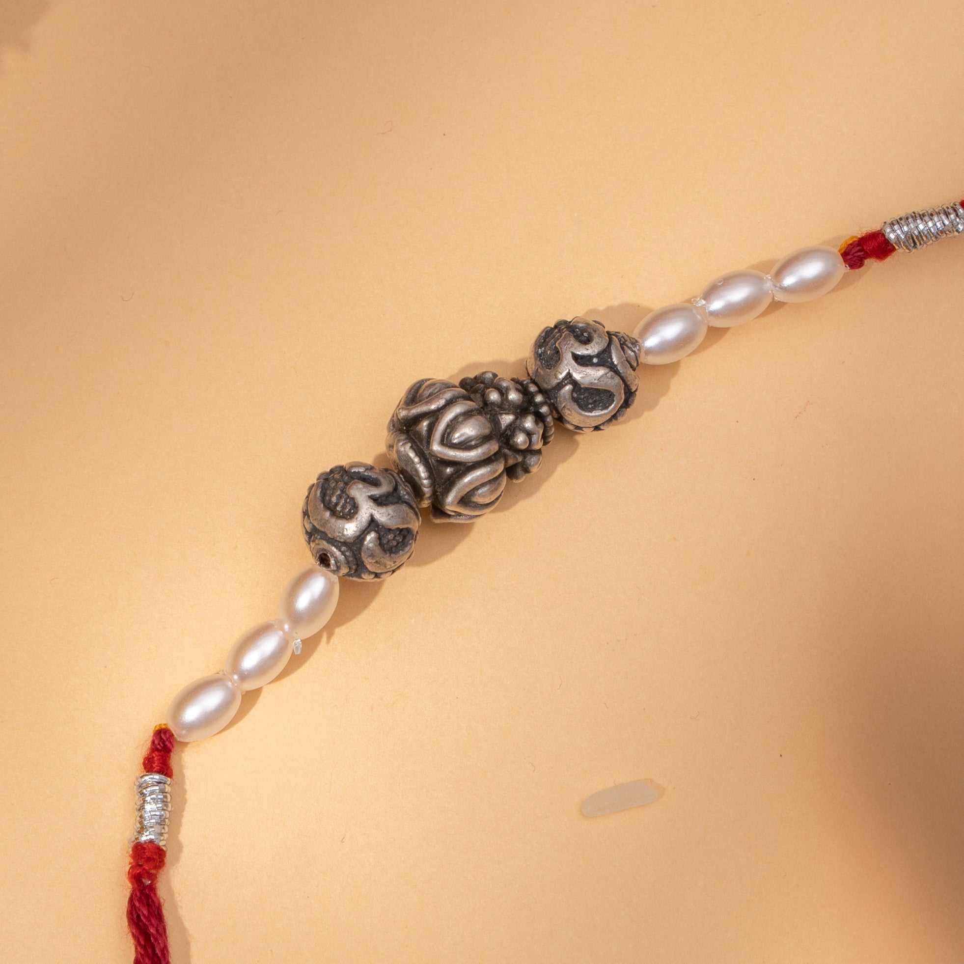 Om Beads Silver Rakhi