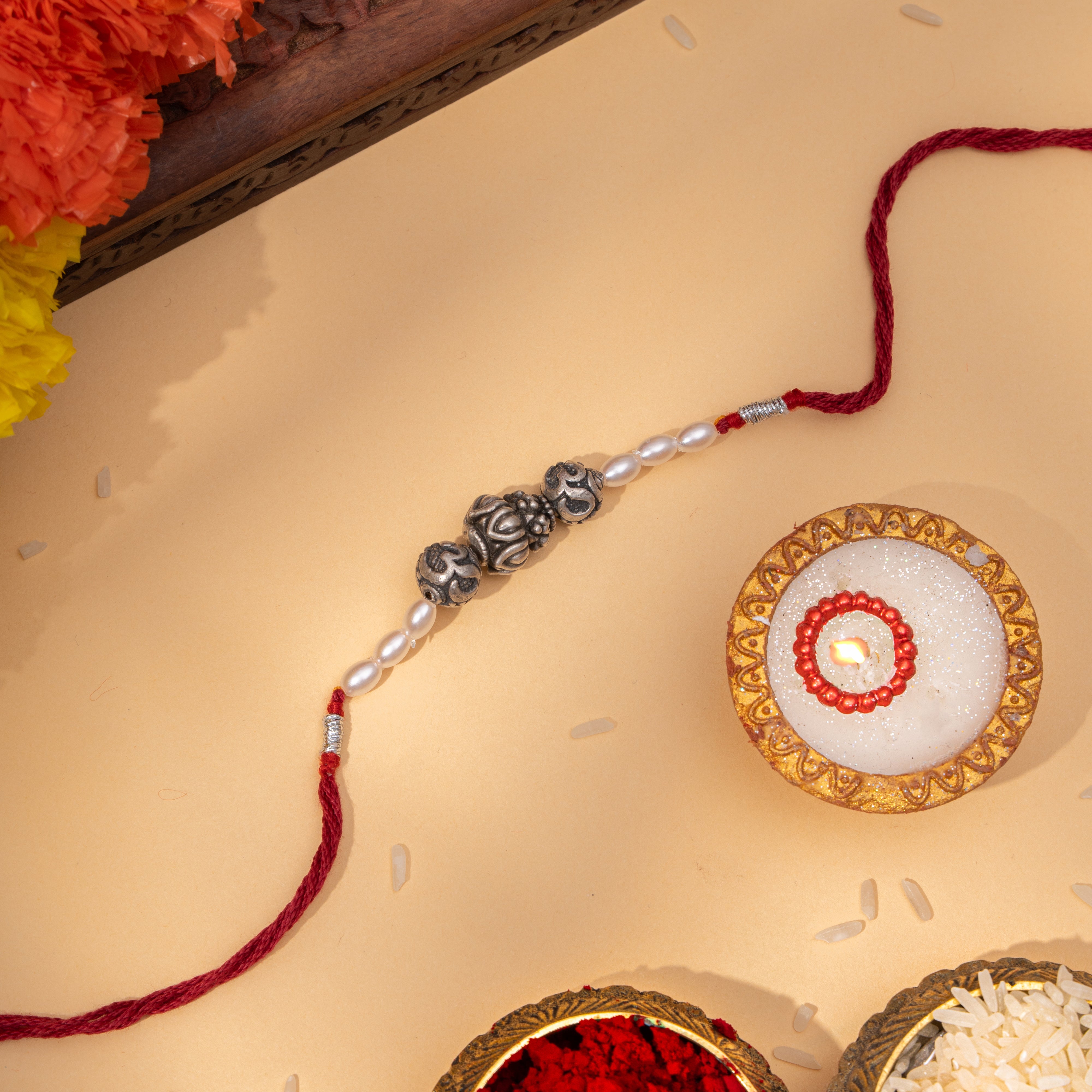 Om Beads Silver Rakhi